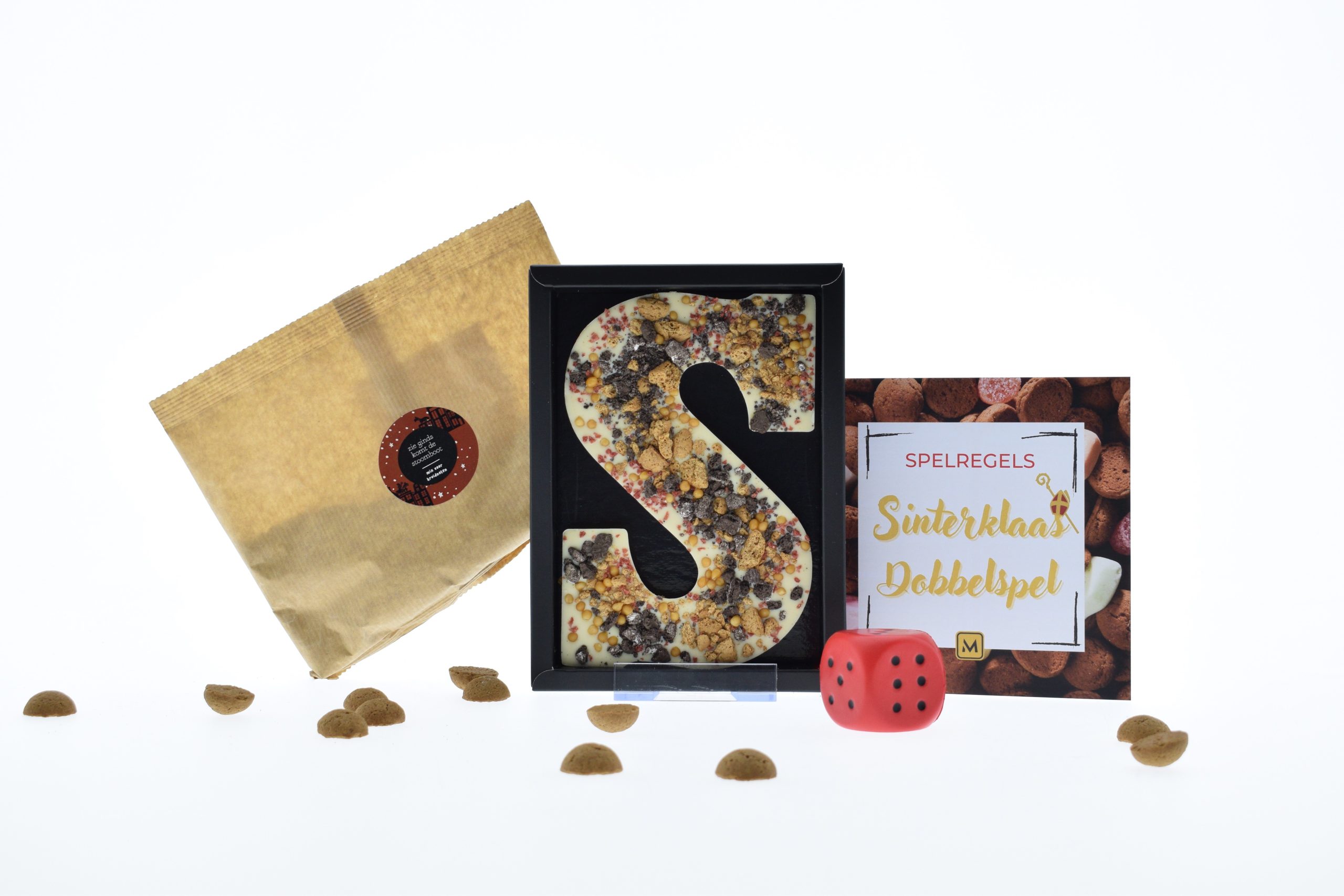 Sint23 - Sinterklaas dobbelspel. Kruidnotenmix om zelf te bakken, ambachtelijke chocolade letter en een dobbelspel.